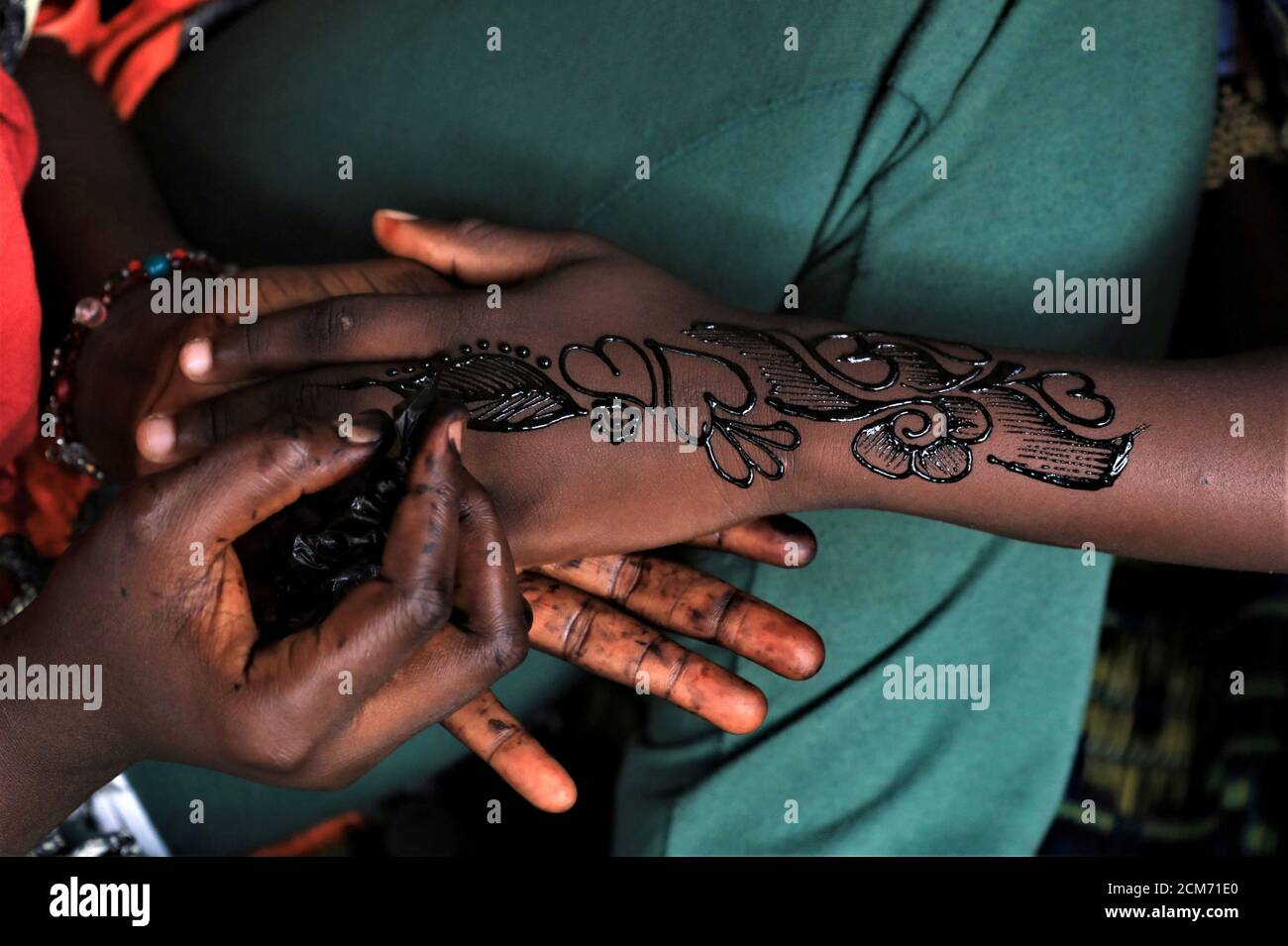 Bintou Diarra 21 Makes Henna Tattoos On A Girl S Hand Ahead Of Eid Al Fitr Amid The Spread Of The Coronavirus Disease Covid 19 In Adjame A Neighbourhood Of Abidjan Ivory Coast May 22 Bintou Diarra 21 Makes Henna Tattoos On A Girl S Hand Ahead Of Eid Al Fitr Amid The Spread Of The Coronavirus Disease Covid 19 In Adjame A Neighbourhood Of Abidjan Ivory Coast May 22