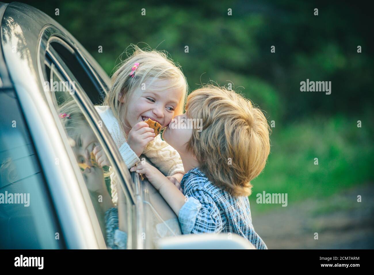 Funny little couple saying goodbye before car travel. Bye bye. Farewell  concept. Little boy gives warm kiss. Goodbye before car travel Stock Photo  - Alamy