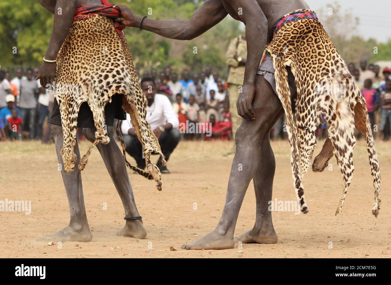 South Sudan's traditional wrestlers Dengic Parrach from Yirol and Ekuach Ladu from Terekeka dressed in a leopard skin as they compete in a peace match during national championships in Juba, South Sudan South Sudan's traditional wrestlers Dengic Parrach from Yirol and Ekuach Ladu from Terekeka dressed in a leopard skin as they compete in a peace match during national championships in Juba, South Sudan