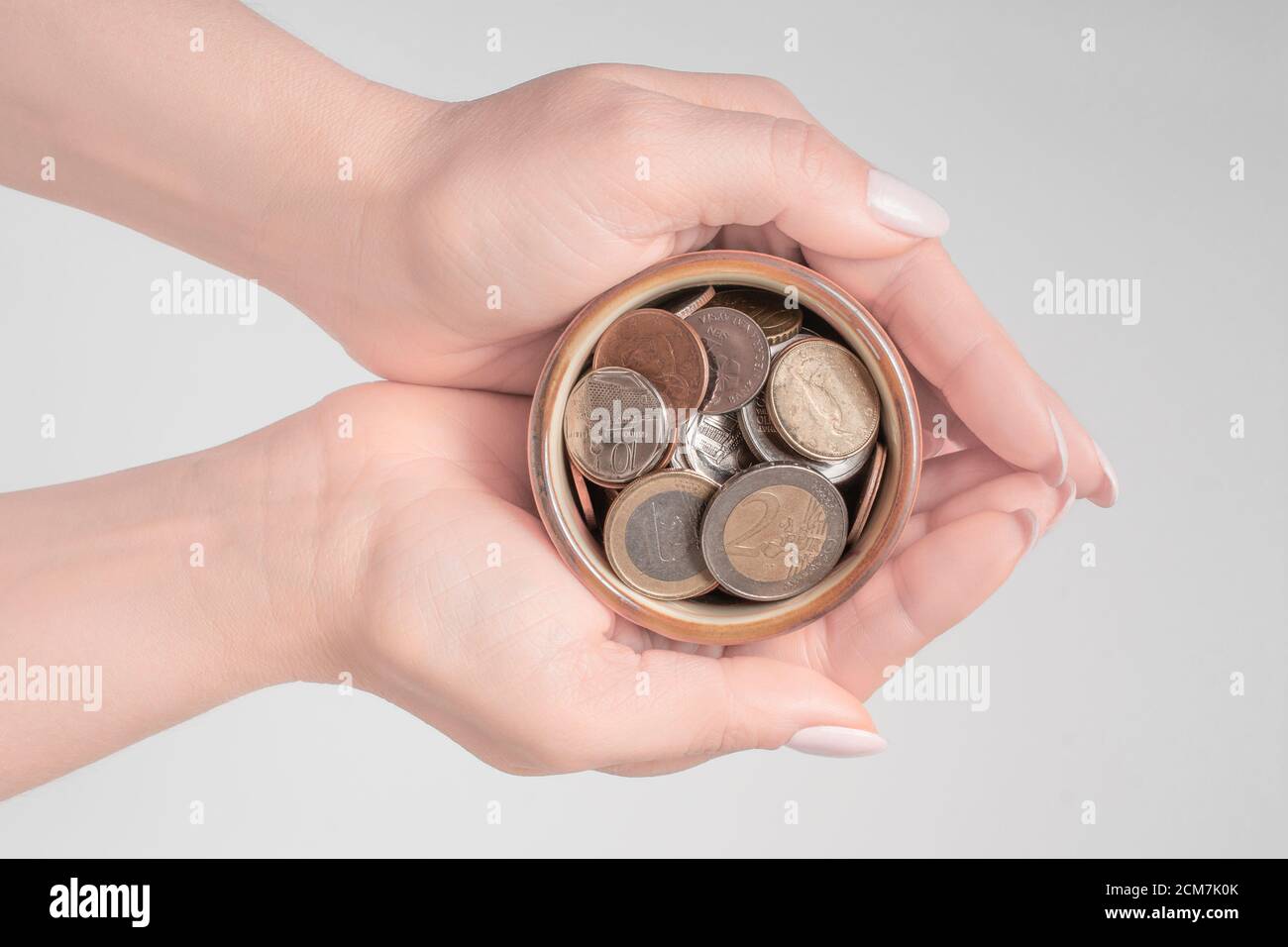 Young woman holding money jar, donation, saving, charity, family finance plan concept, Coronavirus economic stimulus rescue package, superannuation, f Stock Photo
