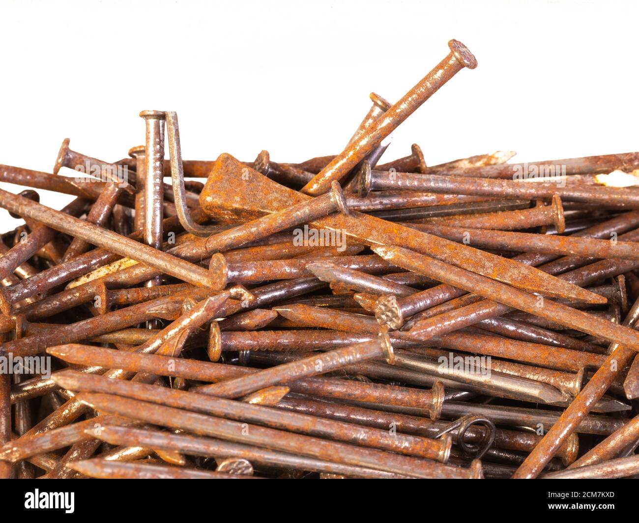 A pile of old and rusty nails with white background Stock Photo