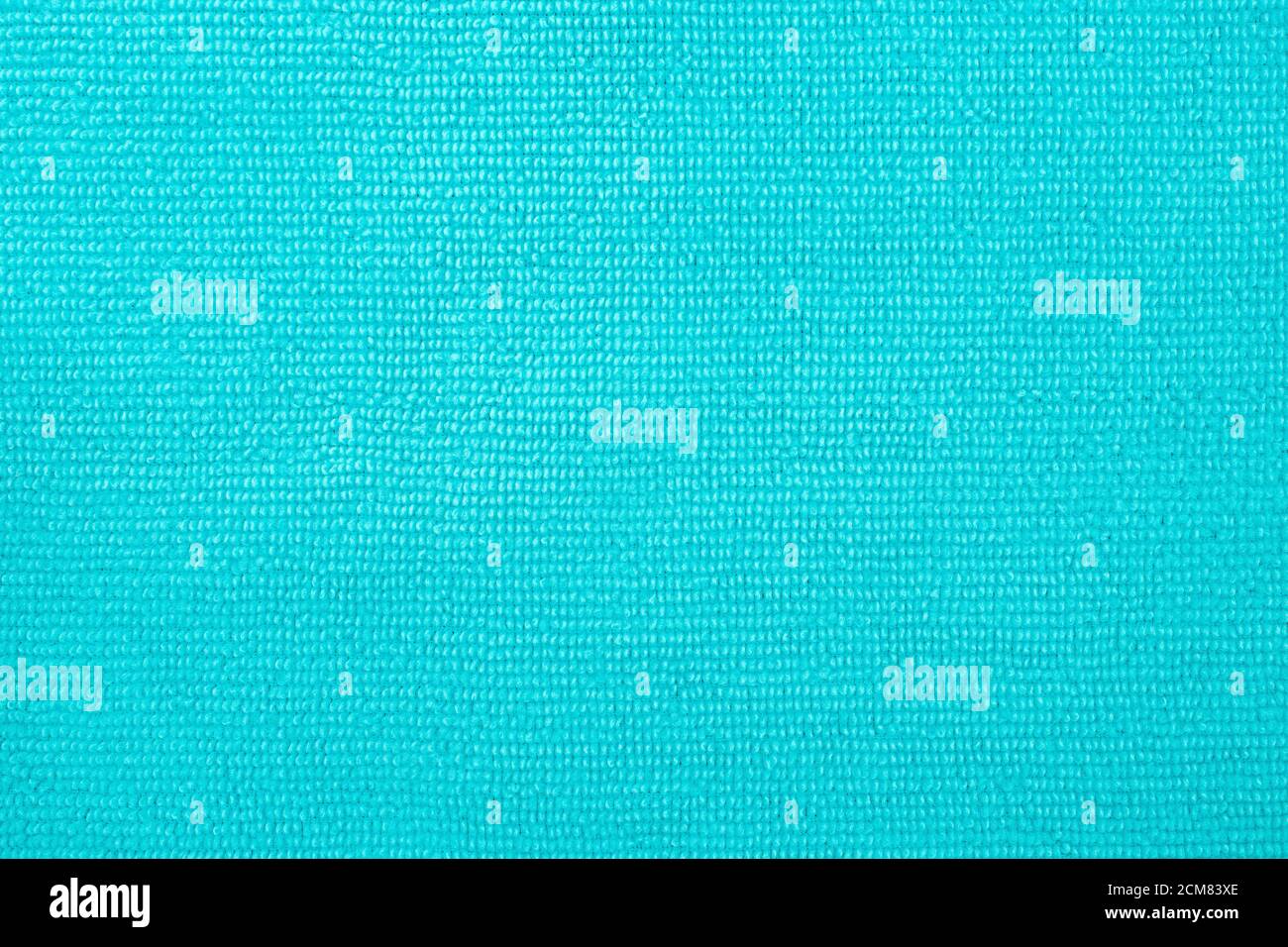Surface of cyan blue microfiber cloth, macro textile pattern background. Stock Photo