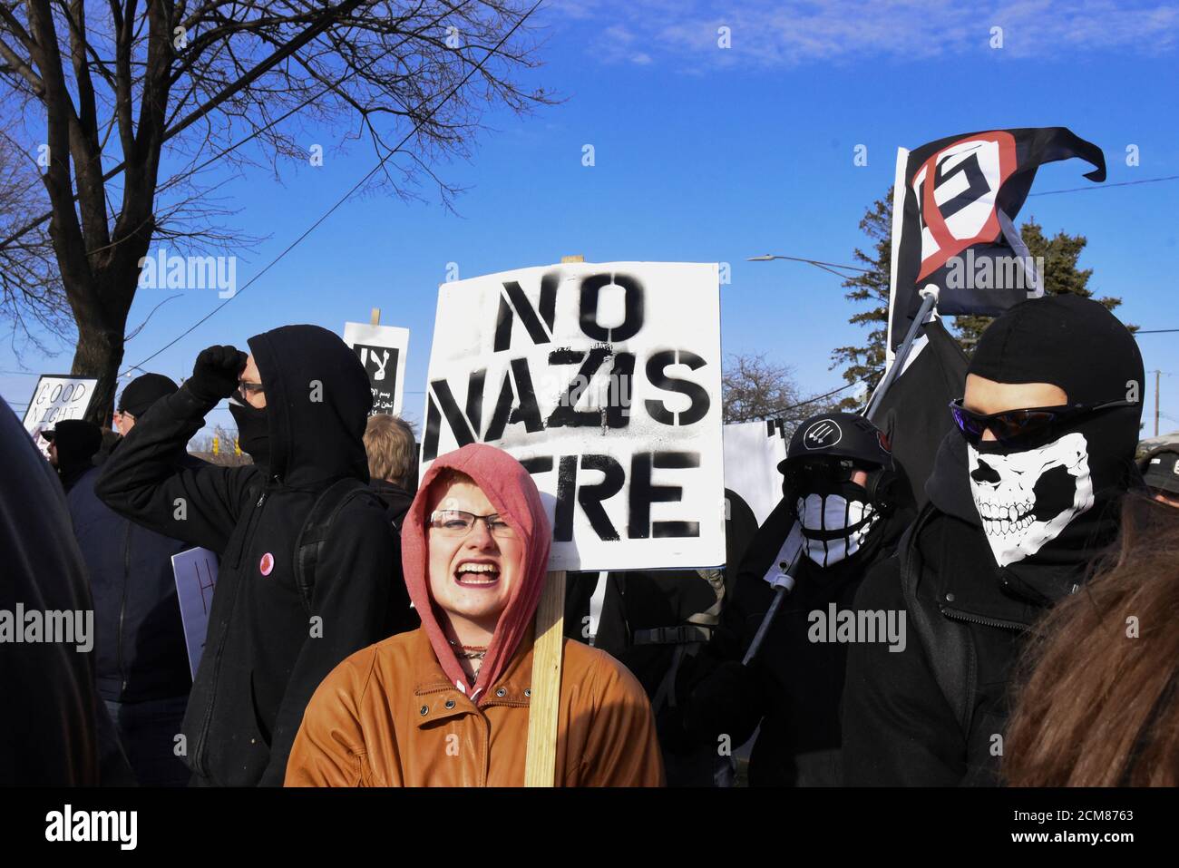 Members of the Great Lakes anti-fascist organization (Antifa) protest against the Alt-right outside a hotel in Warren, Michigan, U.S., March 4, 2018. REUTERS/Stephanie Keith Stock Photo