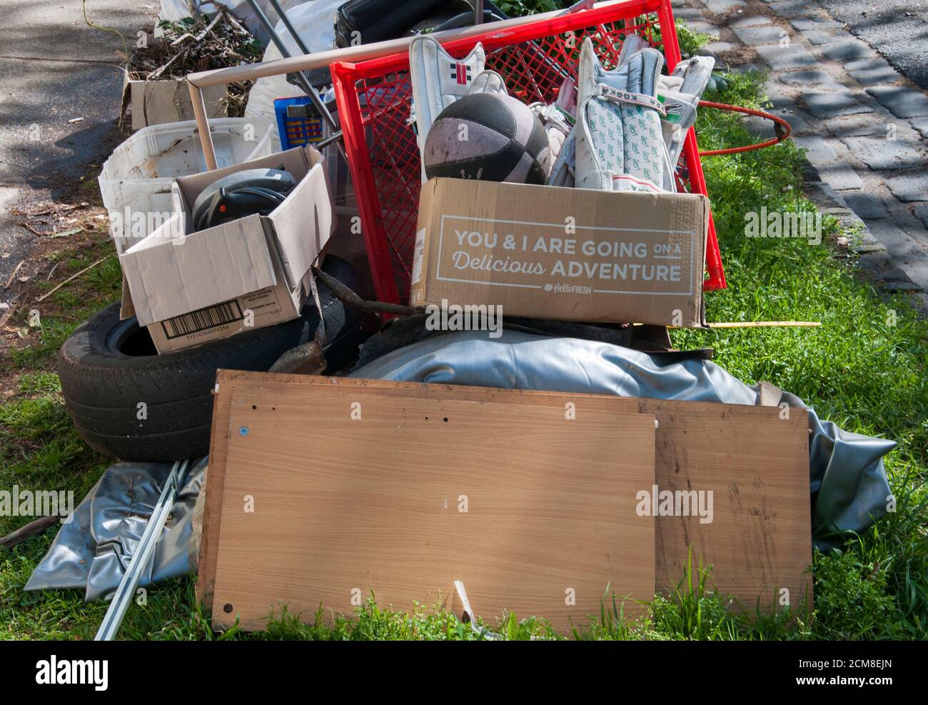 Incongruous message appears on a pile of dumped household junk, Melbourne, Australia Stock Photo