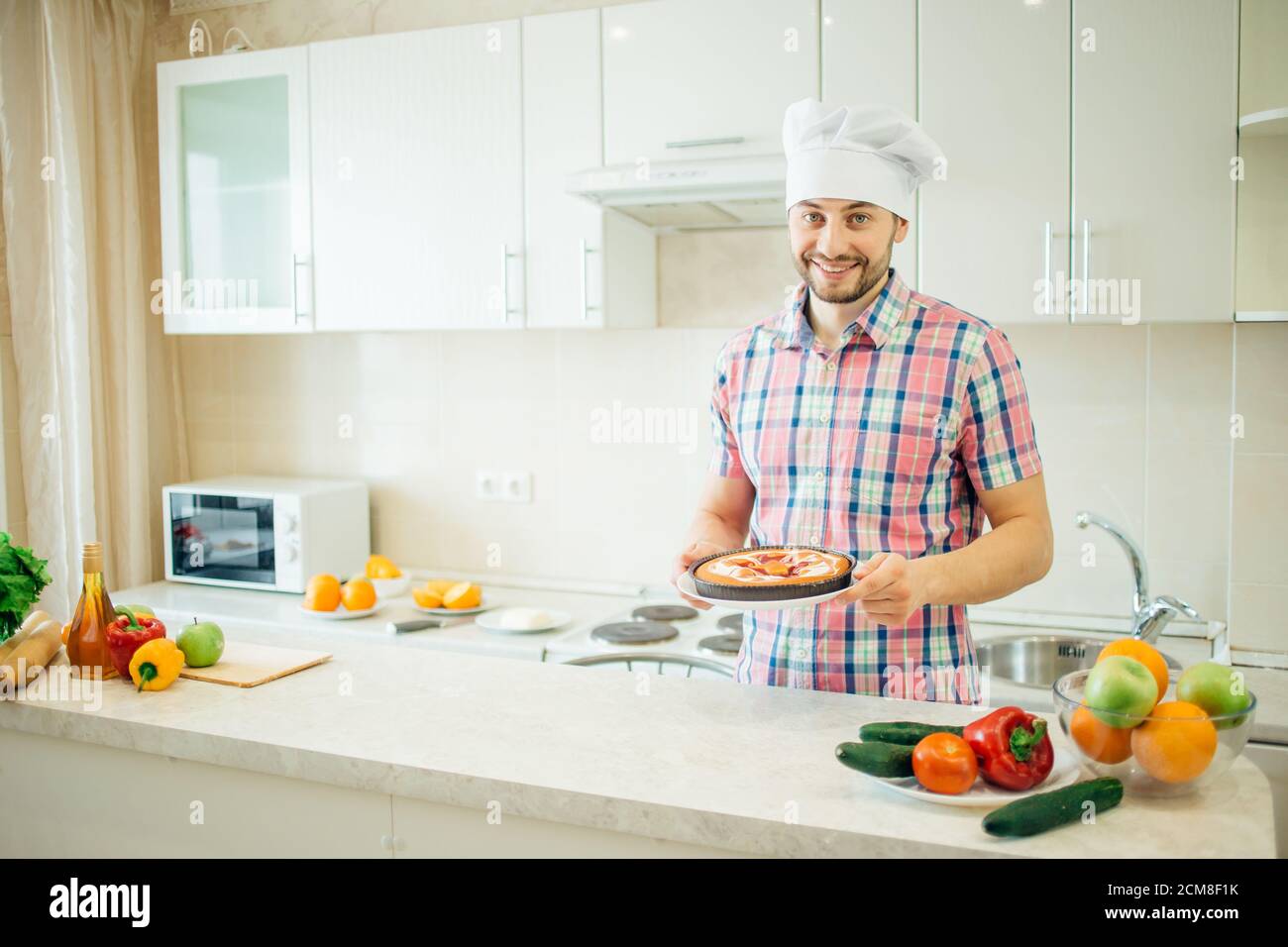 Chef using pepper mill in kitchen at restaurant Stock Photo - Alamy