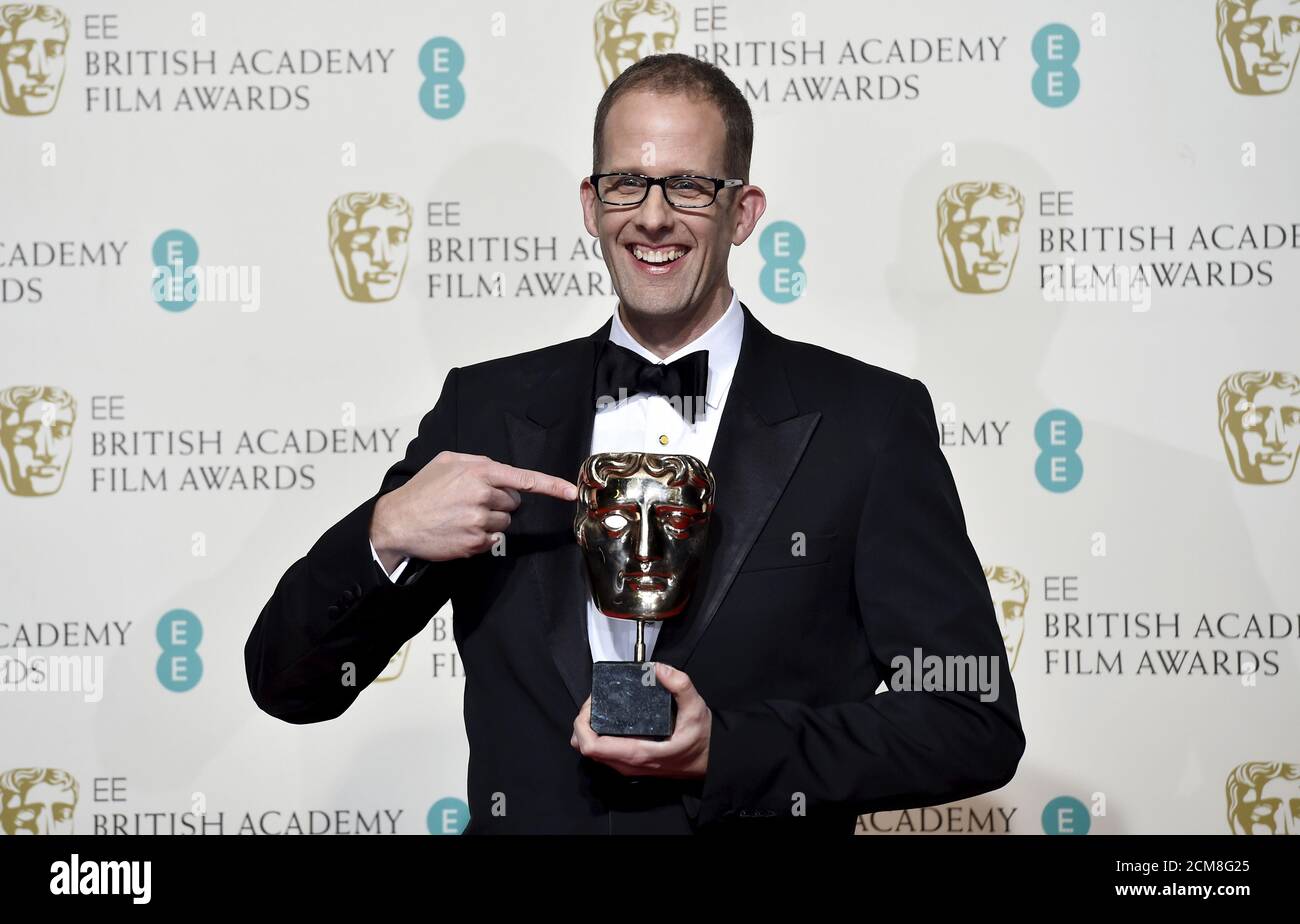 Director Pete Docter poses with his awards for best animated film at the British Academy of Film and Television Arts (BAFTA) Awards at the Royal Opera House in London, February 14, 2016. Director Pete Docter poses with his awards for best animated film at the British Academy of Film and Television Arts (BAFTA) Awards at the Royal Opera House in London, February 14, 2016.