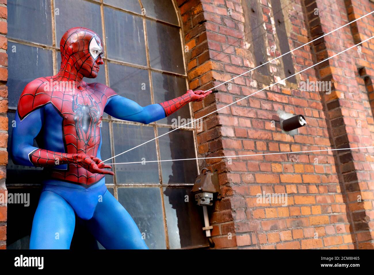 GEEK ART - Bodypainting and Transformaking: Spider-Man photoshooting with Patrick Kiel at the Hefehof in Hamelin on September 15, 2020 - A project by the photographer Tschiponnique Skupin and the bodypainter Enrico Lein Stock Photo