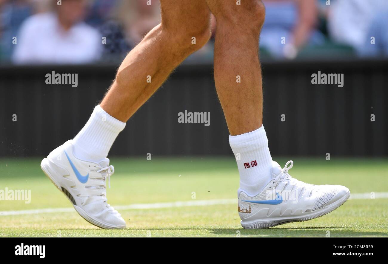 Tennis - Wimbledon - All England Lawn Tennis and Croquet Club, London,  Britain - July 9, 2018. Switzerland's Roger Federer wears Uniqlo socks and  Nike shoes during his fourth round match against