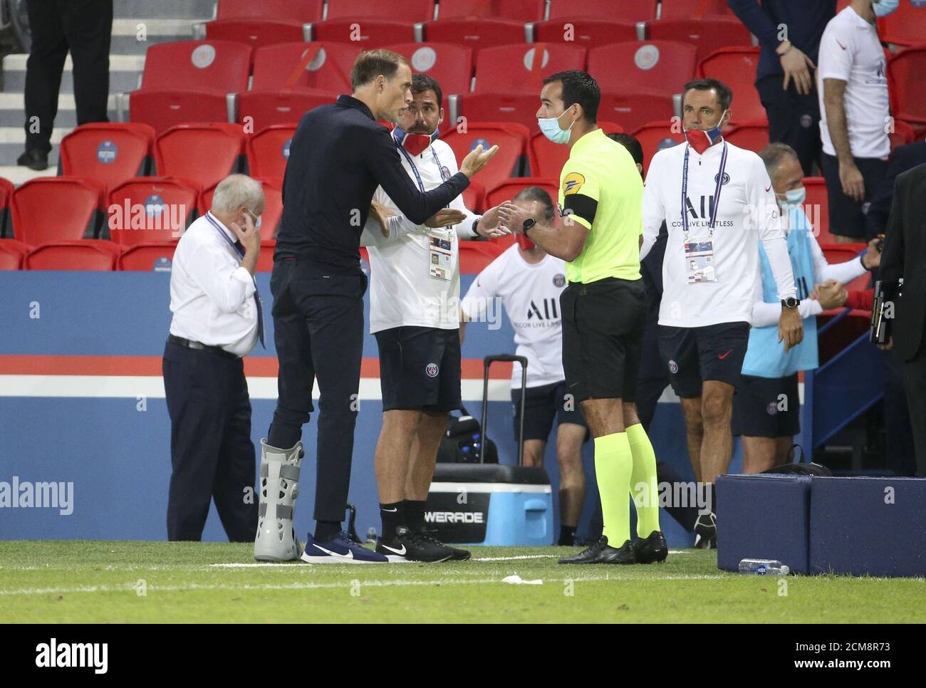 Coach of PSG Thomas Tuchel his assistant coaches Zsolt Low and Arno Michels argue with the fourth referee Aurelien Petit following the French champion Stock Photo
