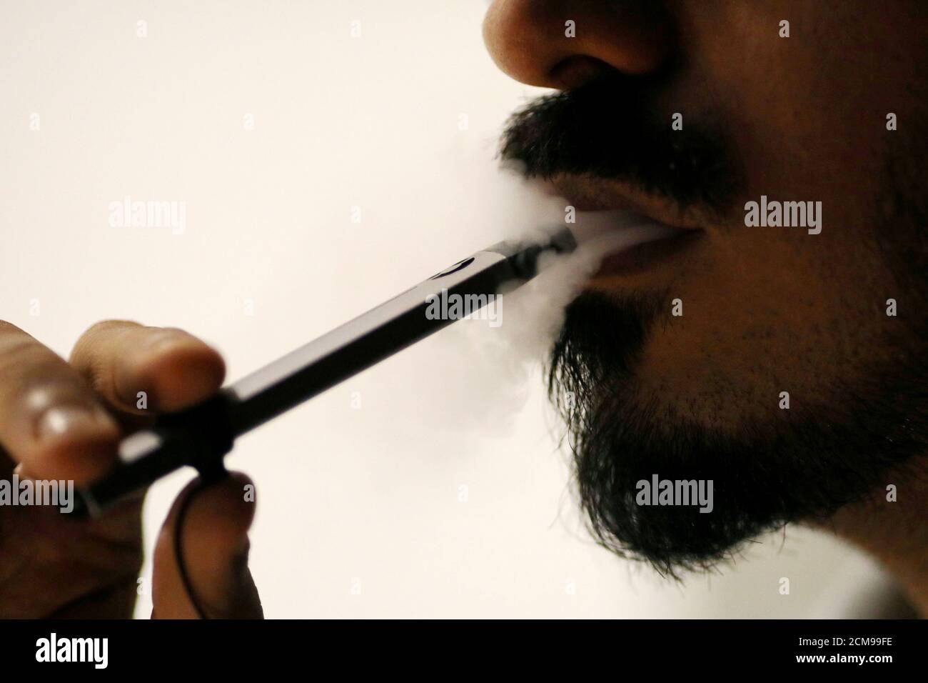 Ali Mansoor, an Emirati vape enthusiast, poses while smoking an e-cigarette  at a cafe in Dubai, United Arab Emirates August 22, 2019. Picture taken  August 22, 2019. REUTERS/Christopher Pike Stock Photo - Alamy