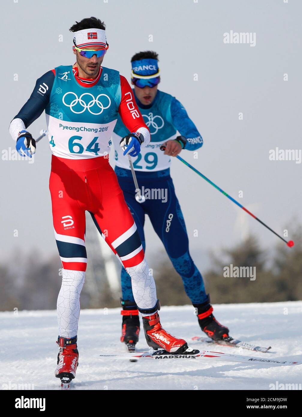 Cross-Country Skiing – Pyeongchang 2018 Winter Olympics – Men's 15km Free – Alpensia Cross-Country Skiing Centre – Pyeongchang, South Korea – February 16, 2018 - Hans Christer Holund of Norway and Adrien Backscheider of France compete. REUTERS/Murad Sezer Stock Photo