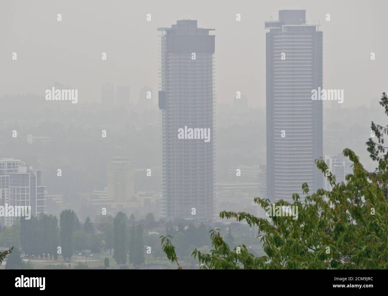 Burnaby, British Columbia, Canada.  16 September 2020.  Thick smoke obscures the condo towers in Burnaby as Metro Vancouver endures another day of air quality advisories.  Smoke from forest fires in Washington State and Oregon continues to drift into the area. Stock Photo