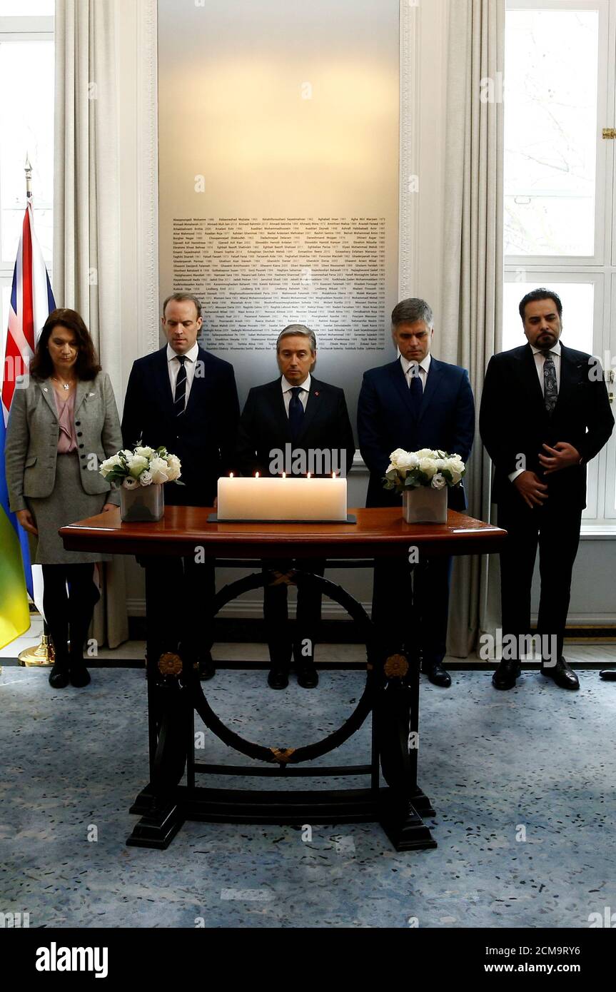 Canada's Minister of Foreign Affairs Francois-Philippe Champagne, Sweden's Foreign Minister Ann Linde, Ukraine's Foreign Minister Vadym Prystaiko, Britain's Foreign Secretary Dominic Raab and Afghanistan's acting Foreign Minister Idrees Zaman hold a moment of silence ahead of a meeting of the International Coordination and Response Group for the families of the victims of the Ukraine International flight which crashed in Iran, at the High Commission of Canada in London, Britain January 16, 2020.     REUTERS/Henry Nicholls Stock Photo