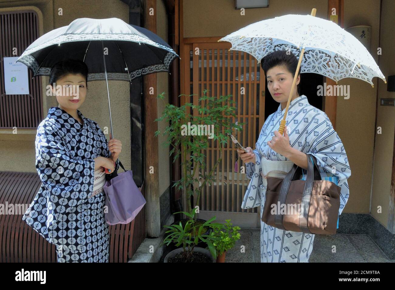 TWO WOMEN WITH KIMONO IN A DOWNTOWN STREET Stock Photo - Alamy