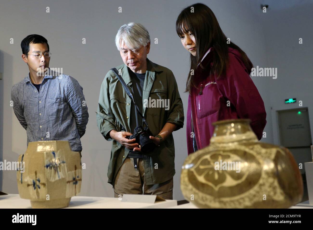 Visitors look at the artists works at the Exhibition of Japanese handicrafts at the National Musuem in Riyadh, Saudi Arabia, February 7, 2020. Picture taken February 7, 2020. REUTERS/Ahmed Yosri Stock Photo