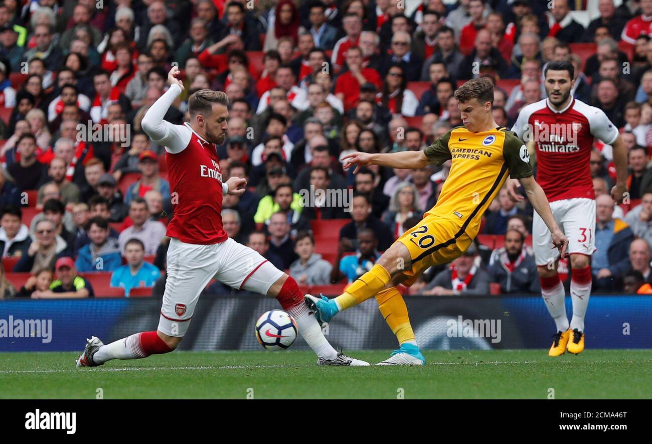 Soccer Football - Premier League - Arsenal vs Brighton & Hove Albion - Emirates Stadium, London, Britain - October 1, 2017   Brighton’s Solly March in action with Arsenal's Aaron Ramsey   REUTERS/Eddie Keogh  EDITORIAL USE ONLY. No use with unauthorized audio, video, data, fixture lists, club/league logos or 'live' services. Online in-match use limited to 75 images, no video emulation. No use in betting, games or single club/league/player publications. Please contact your account representative for further details. Stock Photo
