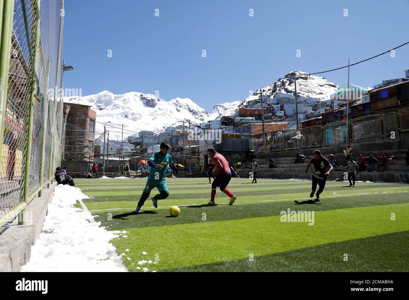 Men Who Work As Miners Play A Game Of Football In Front Of La Bella Durmiente The Sleeping Beauty Glacier In La Rinconada The Andes Peru October 8 19 Reuters Nacho Doce Search