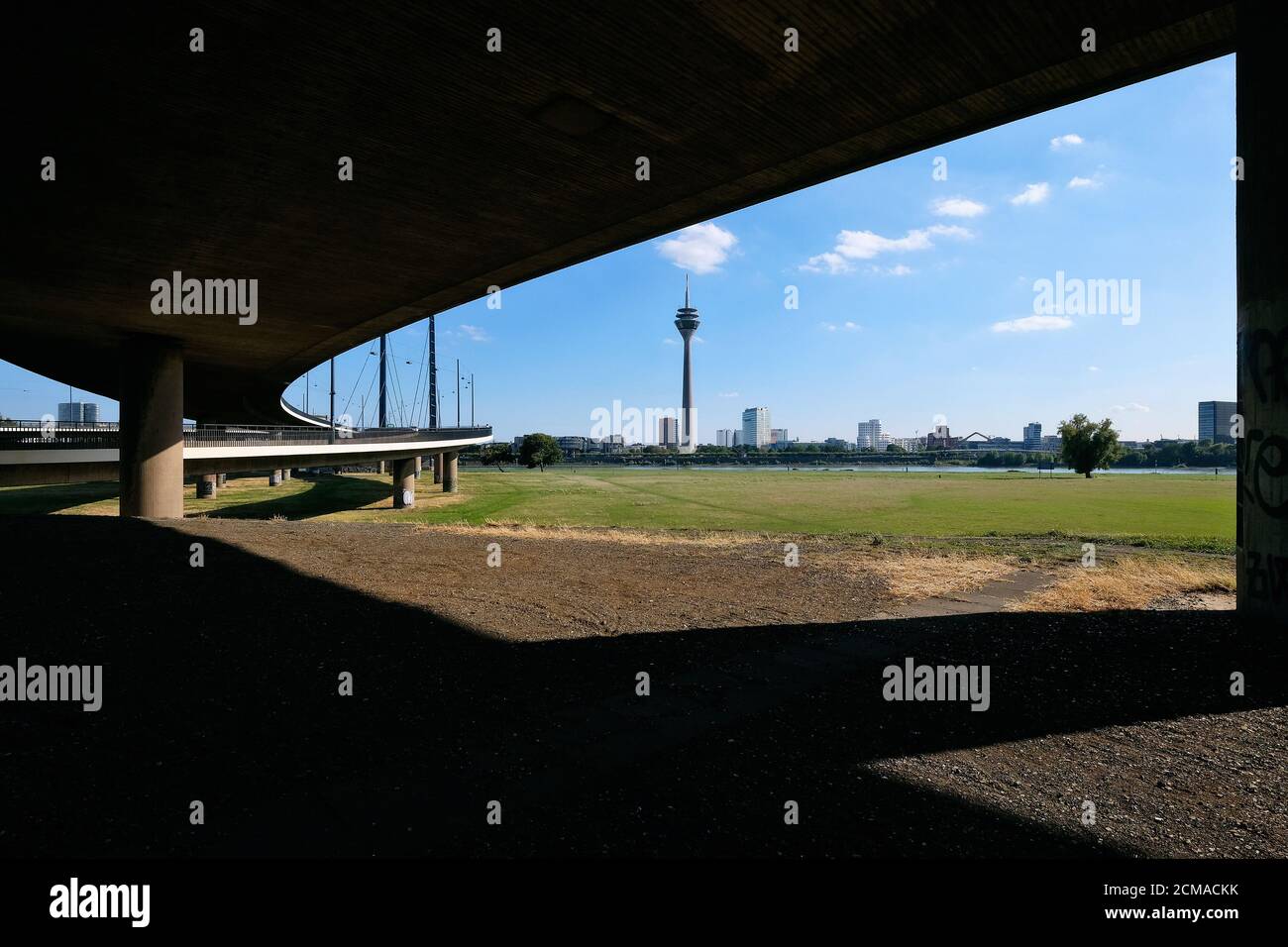 Düsseldorf skyline with television tower, state parliament and city gate as seen from below the Kniebrücke in Oberkassel. Stock Photo