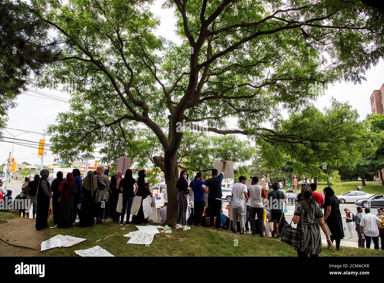 People protest against the June 20 shooting death by Peel Regional Police of Ejaz Ahmed Choudry, 62, who family members say suffered from schizophrenia in Malton, Ontario, Canada June 22, 2020. REUTERS/Carlos Osorio Stock Photo