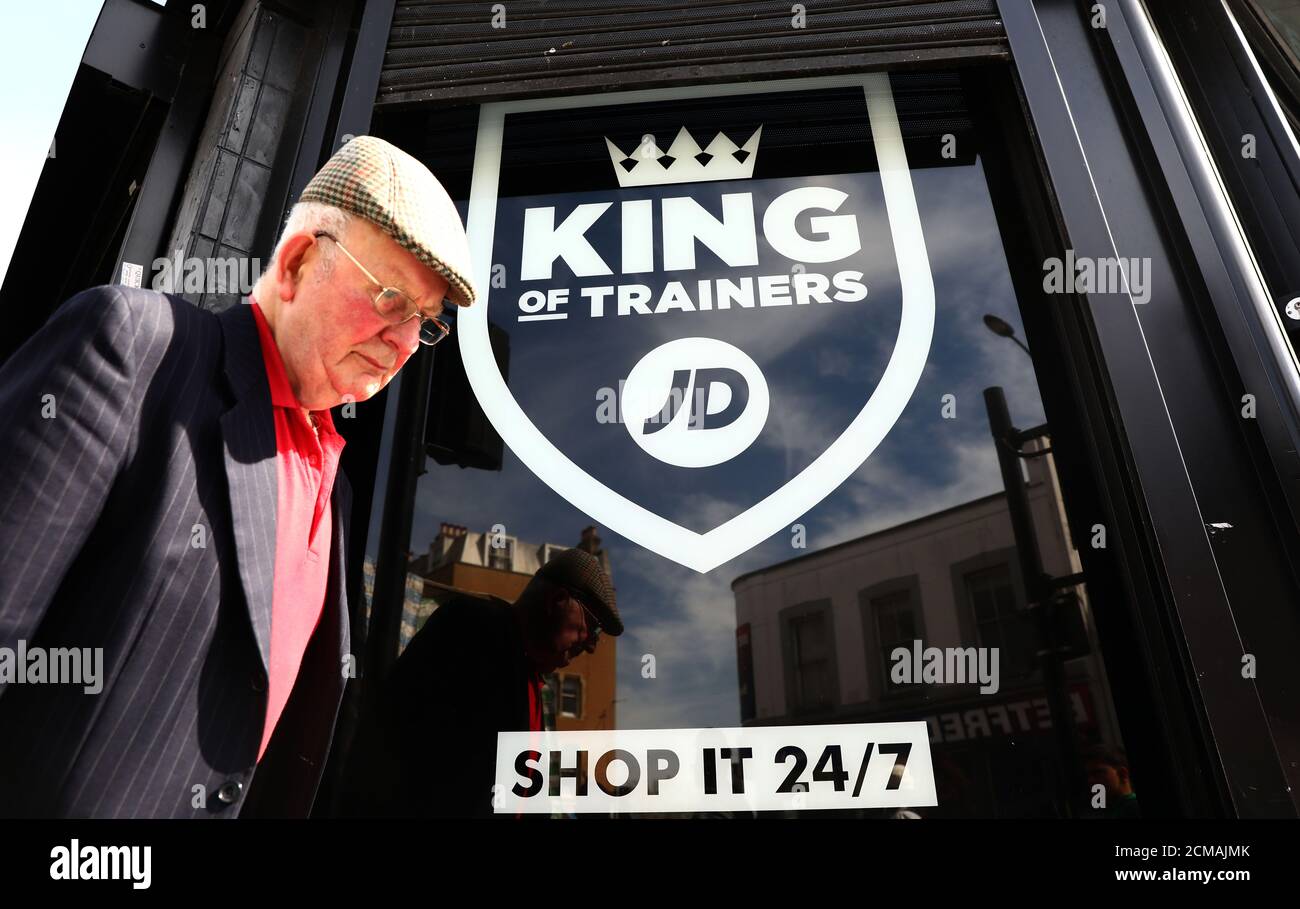 A man passes a JD Sports store in London, Britain April 11, 2017.  Shares in Britain's JD Sports Fashion Plc climbed to a record high after strong demand for leisure clothing helped to drive a 55 percent rise in headline annual pretax profit, its biggest increase in eight years REUTERS/Neil Hall Stock Photo