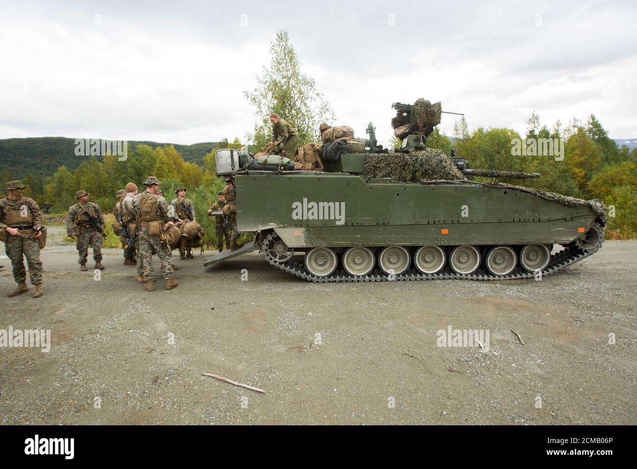 U.S. Marines with Marine Rotational Force – Europe 20.2, Marine Forces Europe and Africa, board a Norwegian CV9030N Infantry Fighting Vehicle during a force-on-force field training exercise in Setermoen, Norway, Sept. 8, 2020. The training exercise tested the Marines against Norwegian mechanized infantry with Brigade North/Norwegian Army to practice and develop anti-tank tactics within mountainous terrain. MRF-E conducts various exercises including arctic cold-weather and mountain-warfare training, as well as military-to-military engagements throughout Europe that enhance cooperation among par Stock Photo