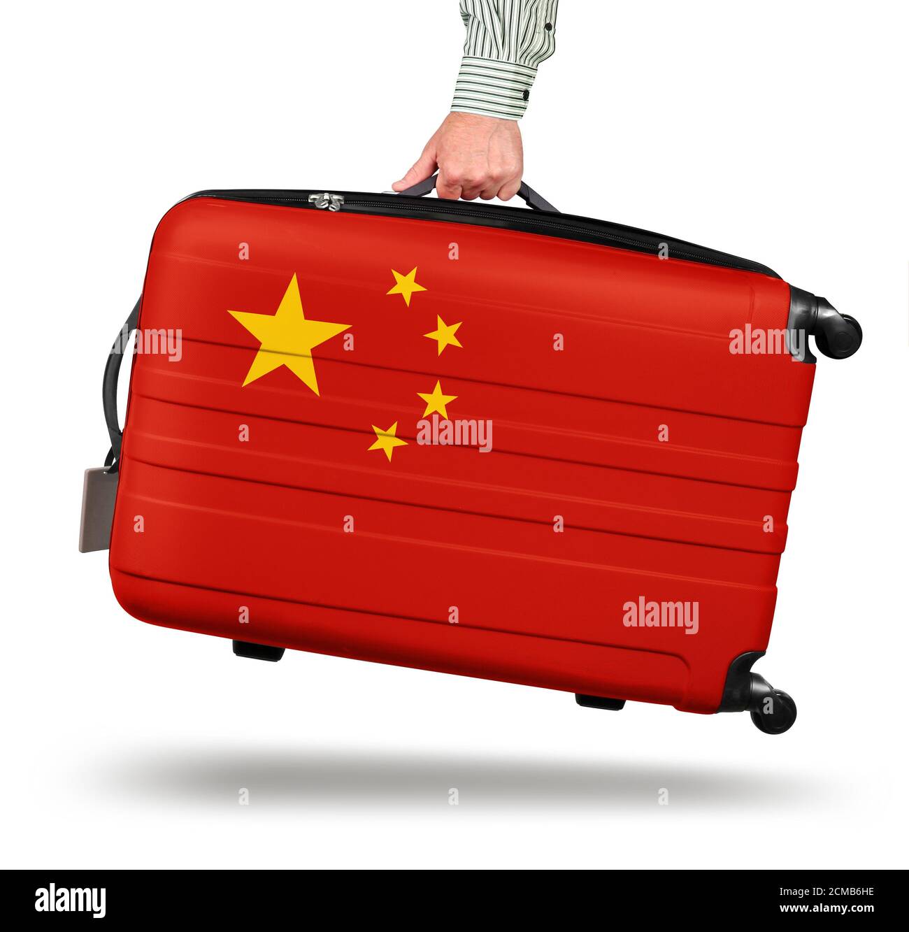 Hand holding modern suitcase China flag design isolated on white Stock Photo