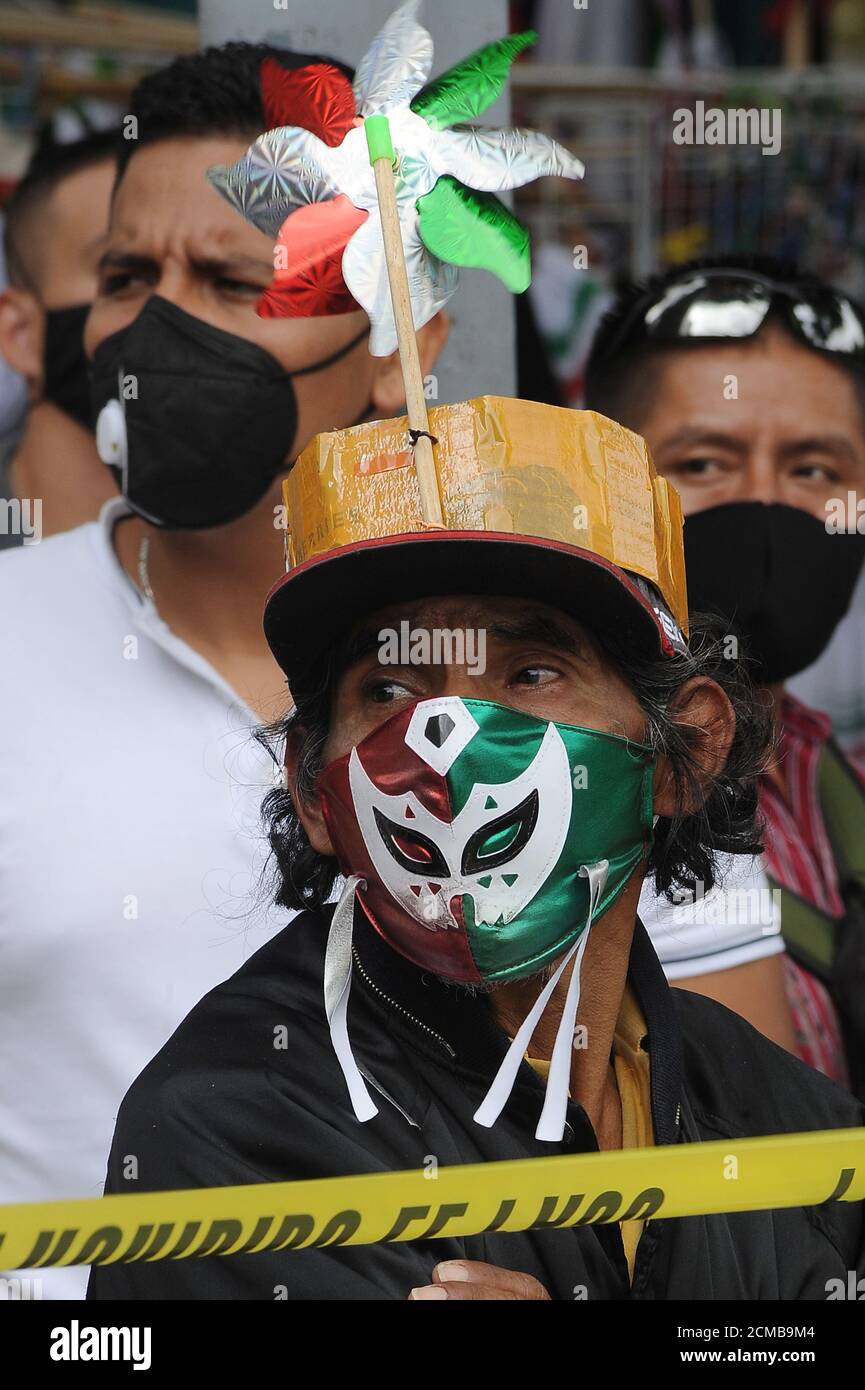 Non Exclusive: MEXICO CITY, MEXICO - SEPTEMBER 16 :A man wears face mask while waits  the Military Parade to celebrate the 210th anniversary of the In Stock Photo