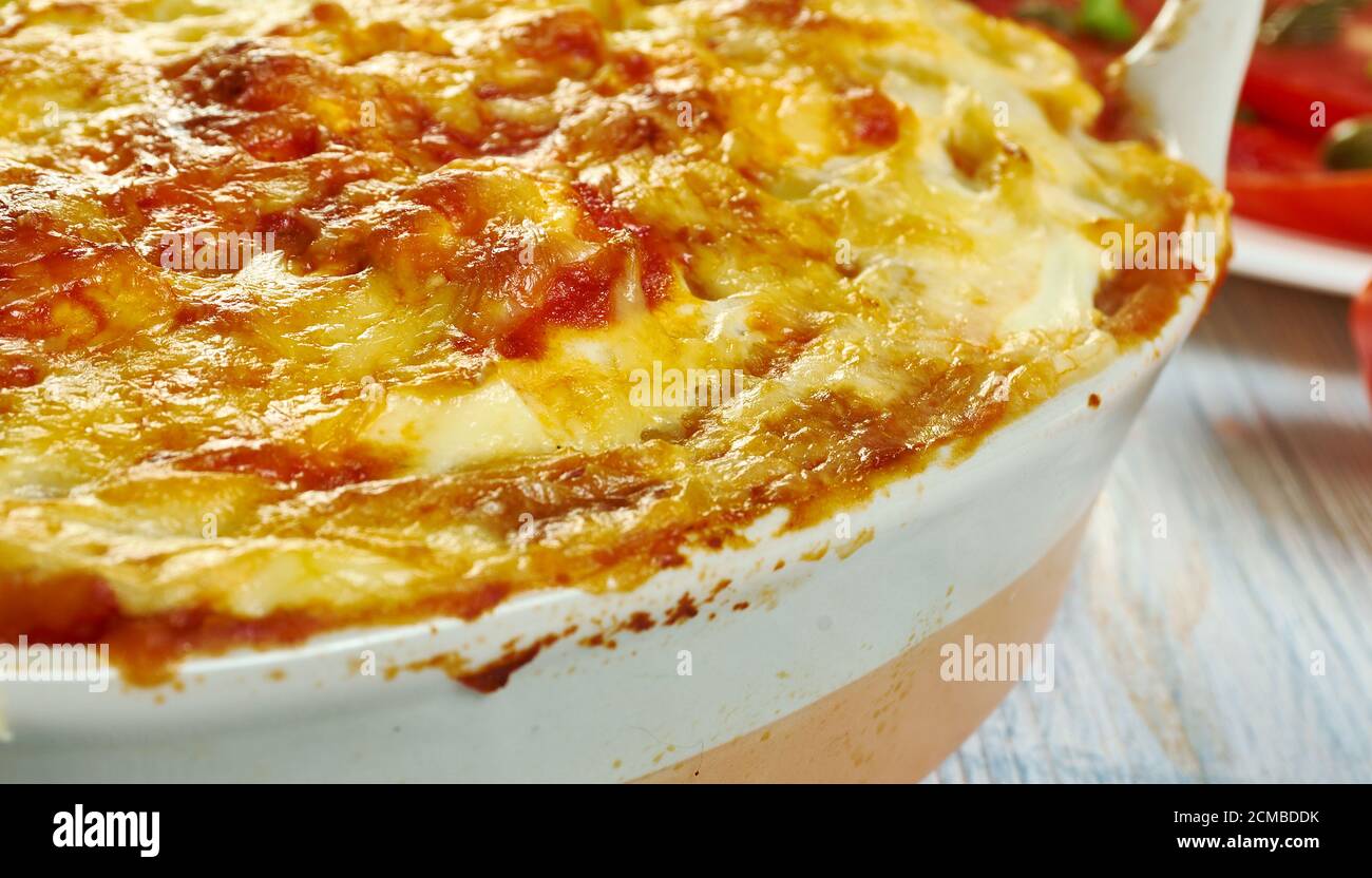 Gatto' di patate con ragu, potato with meat casserole, Sicilian cuisine, Traditional assorted Italy dishes, Top view. Stock Photo