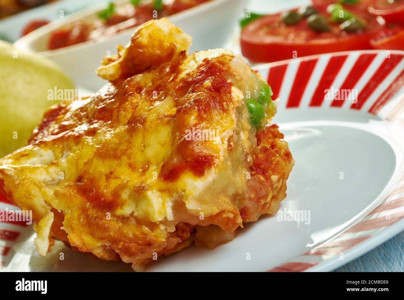 Gatto' di patate con ragu, potato with meat casserole, Sicilian cuisine, Traditional assorted Italy dishes, Top view. Stock Photo