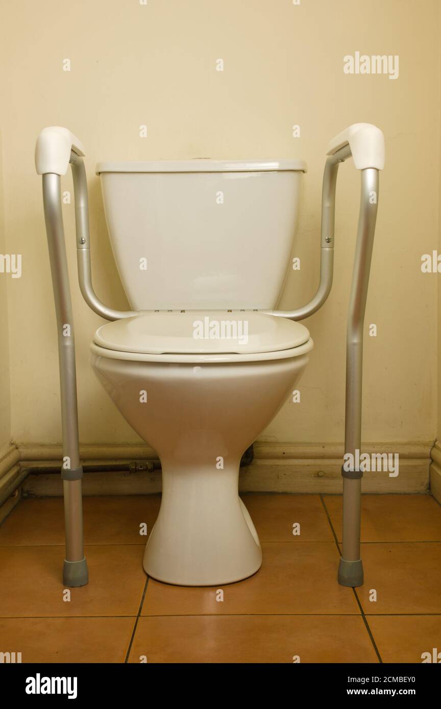 Domestic disabled toilet frame an inexpensive way to improve the safety of elderly and disabled users when they use the toilet Stock Photo