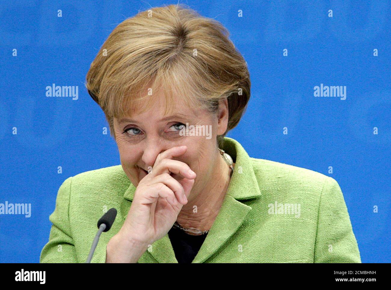 German Chancellor Angela Merkel gestures during a regional party leader convention of the conservative Christian Democratic Union (CDU) party in Berlin June 13, 2009.  REUTERS/Thomas Peter  (GERMANY POLITICS HEADSHOT) Stock Photo