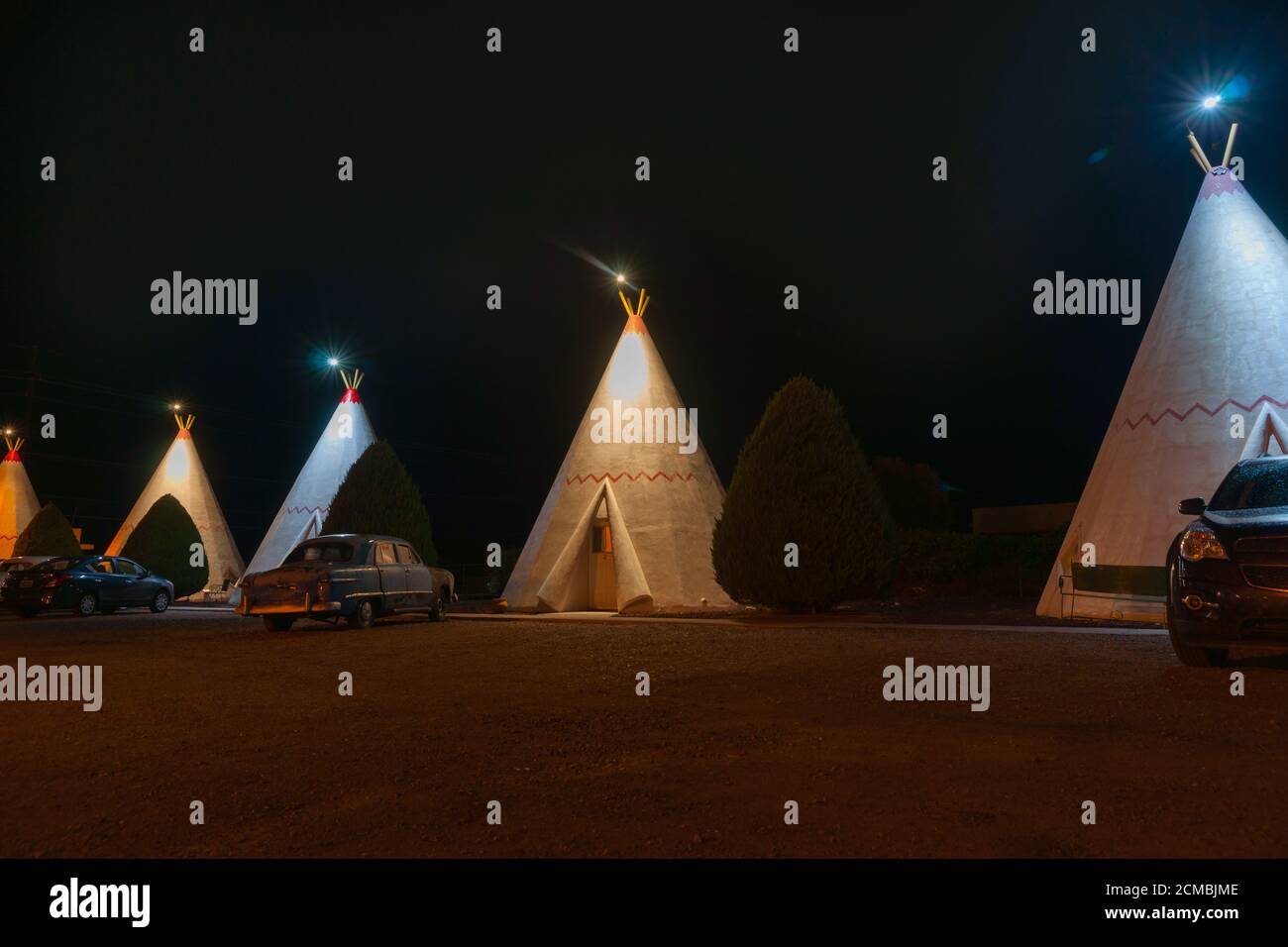 Holbrook USA - September 22 2015; Wigwam Motel units with vehicles outside at night on famous Route 66. Stock Photo