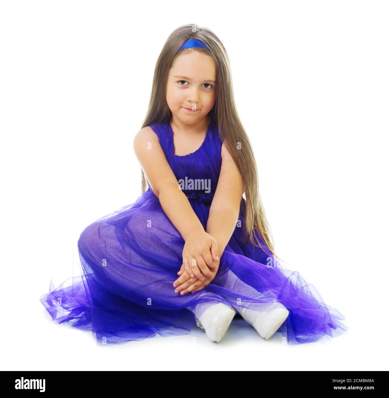 Little girl in blue dress isolated Stock Photo Alamy