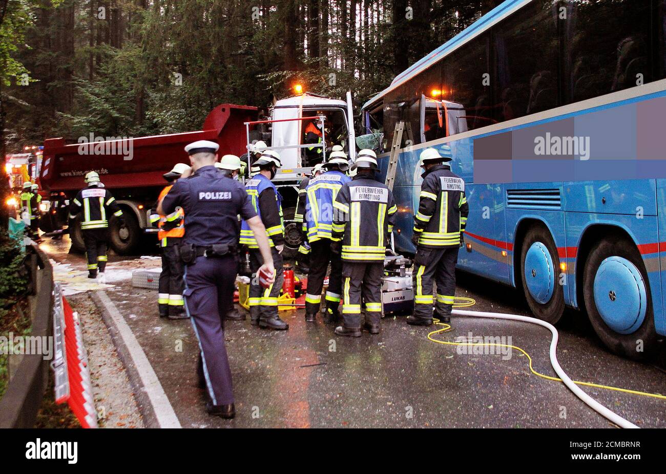 Breitbrunn, Germany. 17th Sep, 2020. Police and firefighters are working at an accident site. A truck driver crashed head-on into a school bus in the Rosenheim district. The impact trapped the man in his truck, and he was flown to hospital with serious injuries. The 41-year-old driver of the school bus was taken to hospital with moderate injuries. At the time of the accident there were no students on the bus. Credit: Josef Reisner/dpa/Alamy Live News Stock Photo