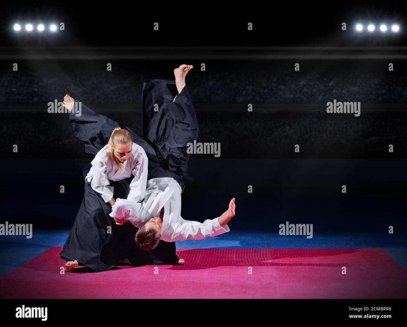 Fight between two aikido fighters at sport hall Stock Photo