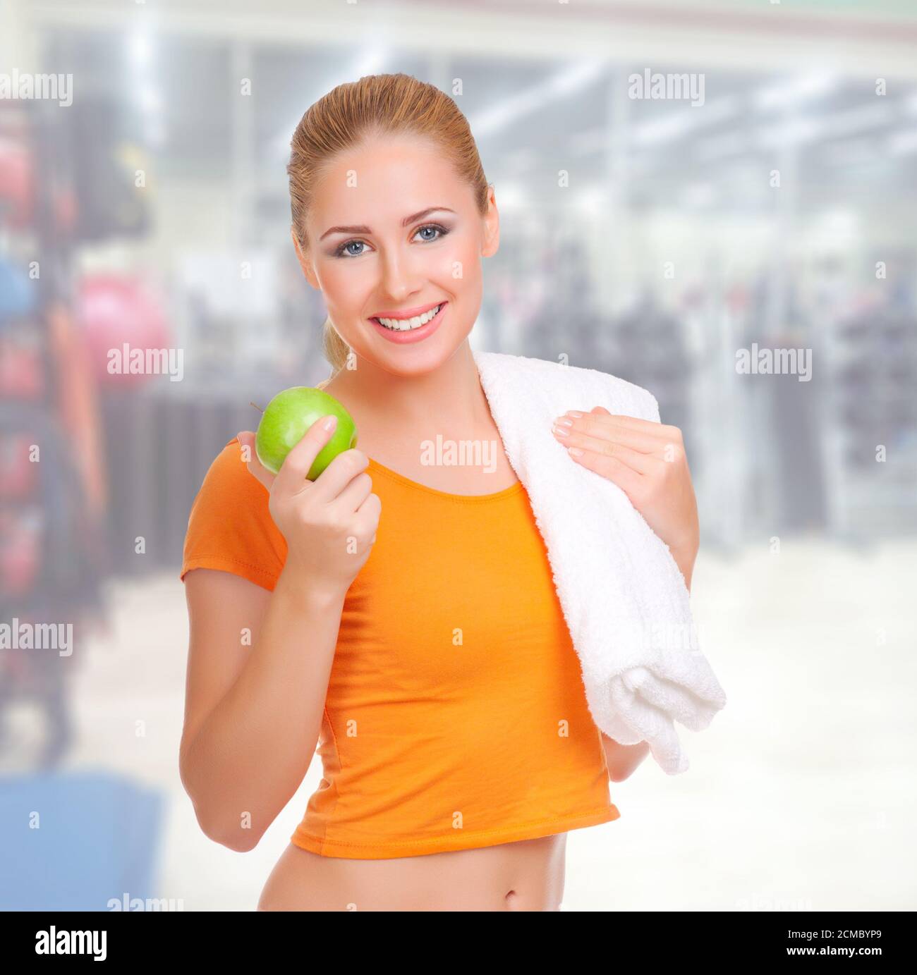 Young sporty woman eating apple hi-res stock photography and images - Alamy
