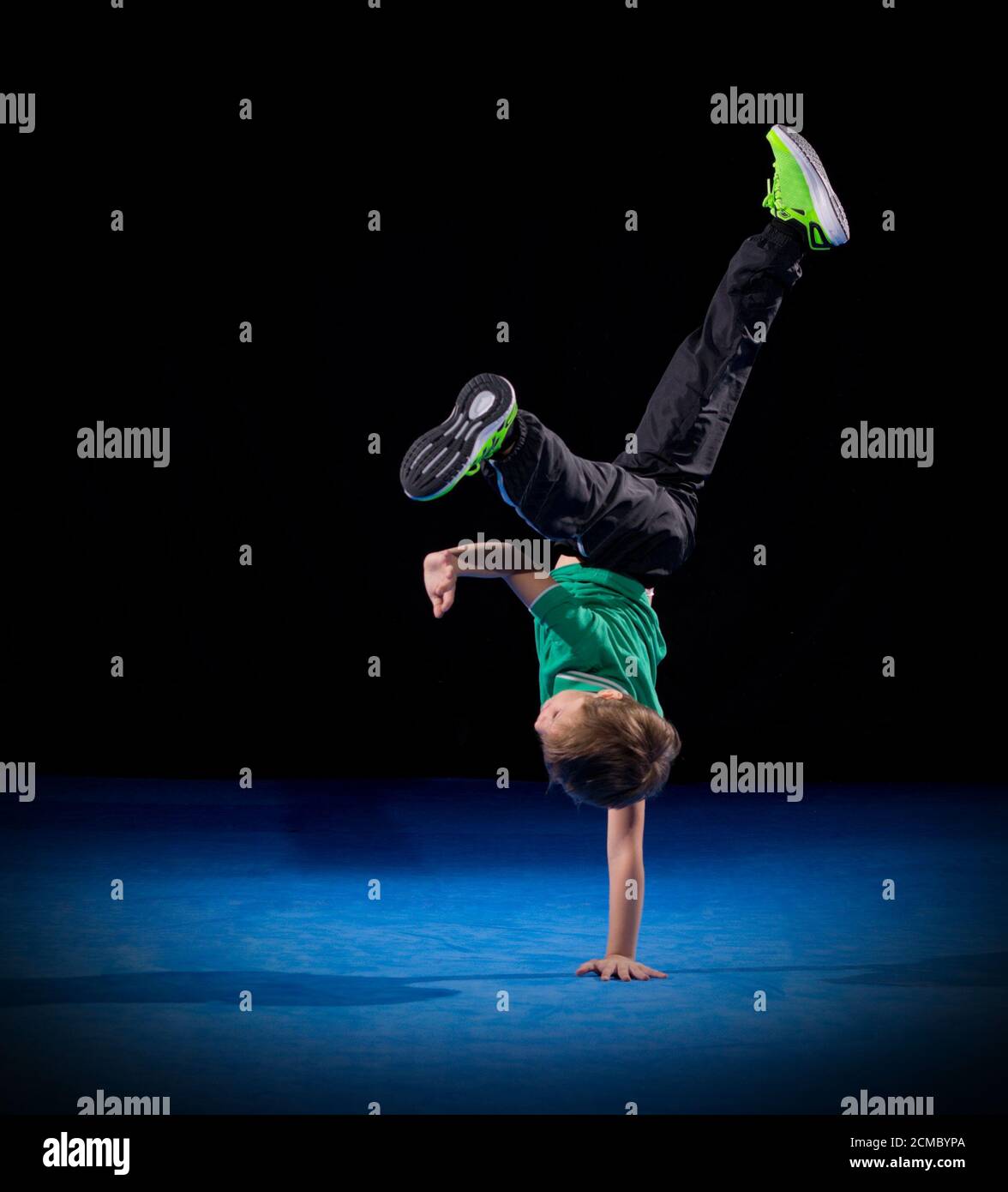 Little boy breakdancer on black Stock Photo