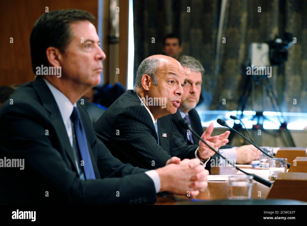 Homeland Security Secretary Jeh Johnson (C) testifies on 'Threats to the Homeland' as FBI Director James Comey Jr. (L) and Director of the National Counterterrorism Center Nicholas Rasmussen listen during a Senate Homeland Security and Governmental Affairs Committee hearing on Capitol Hill in Washington, October 8, 2015. REUTERS/Jim Bourg Stock Photo