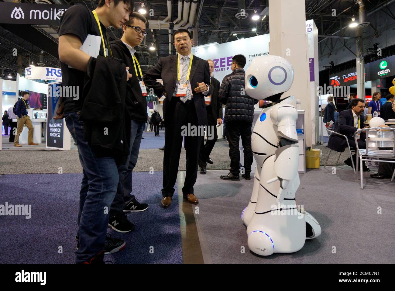 Shengguang Zhang (C) talks about the Baymax Intelligent Service Robot with  showgoers at the Robotics Marketplace at CES in Las Vegas, U.S., January 5,  2017. REUTERS/Rick Wilking Stock Photo - Alamy