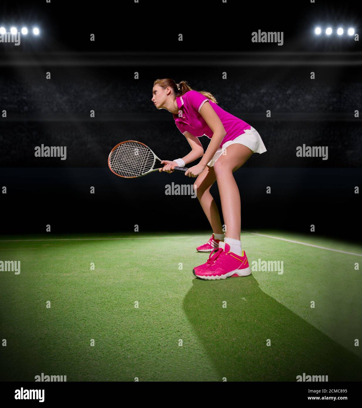 Young woman tennis player at stadium Stock Photo