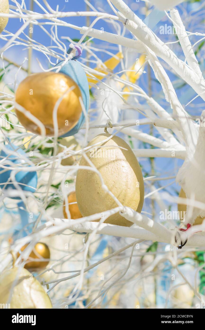 colorfull easter egg tree. brights eggs hanging from branches. Stock Photo