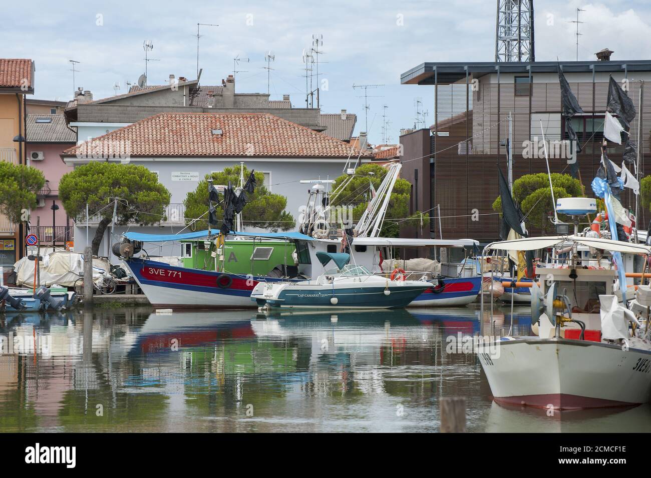 ITALY, Caorle - JULY 11, 2014: Tourist boat in the port of Caorle. Stock Photo