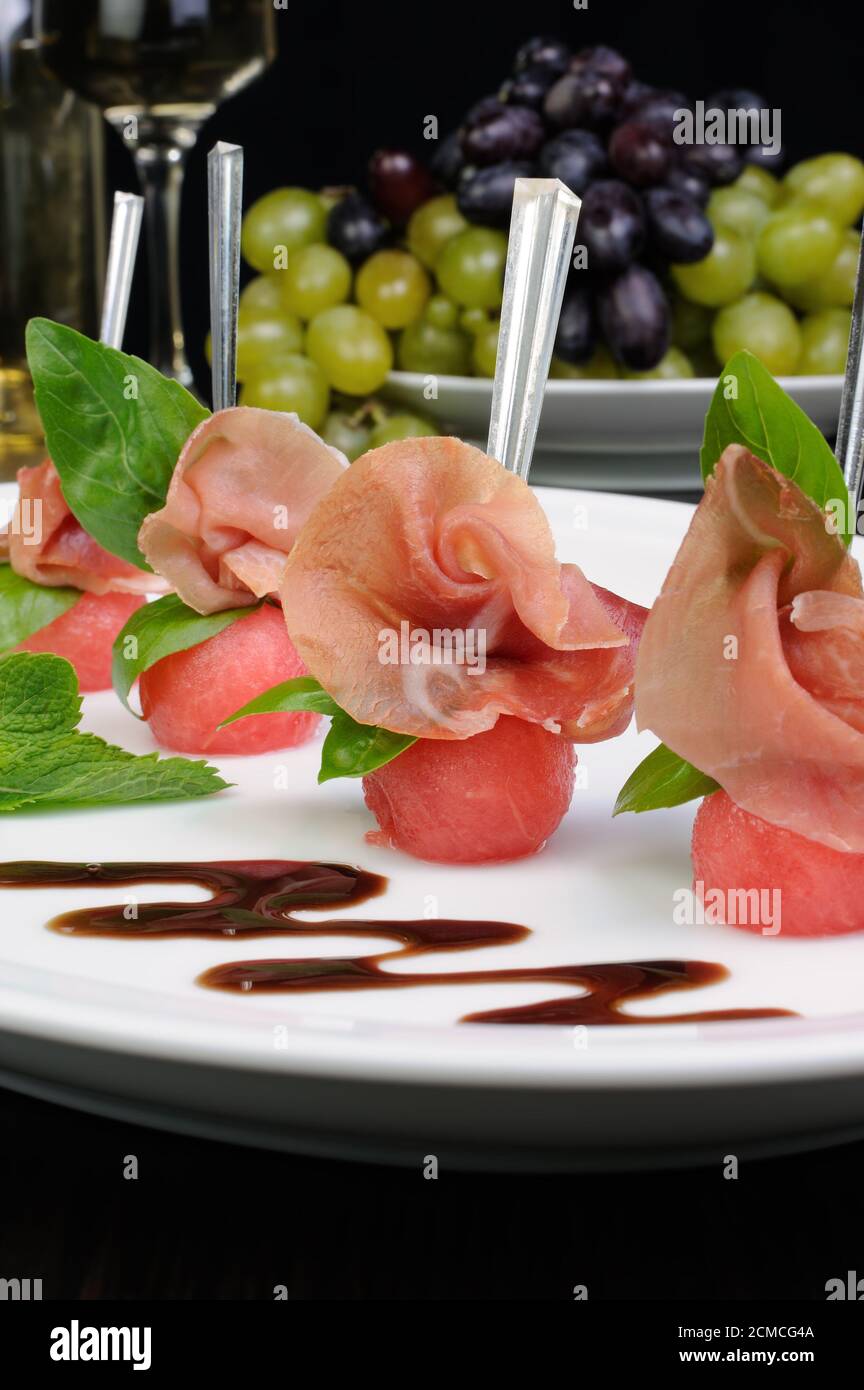 Canape of watermelon balls with gammon Stock Photo