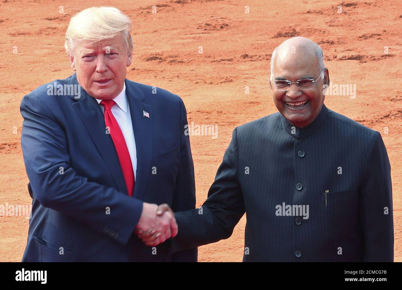 U.S. President Donald Trump and India's President Ram Nath Kovind shake  hands for a photo during Trump's ceremonial reception at the forecourt of  India's Rashtrapati Bhavan Presidential Palace in New Delhi, India,