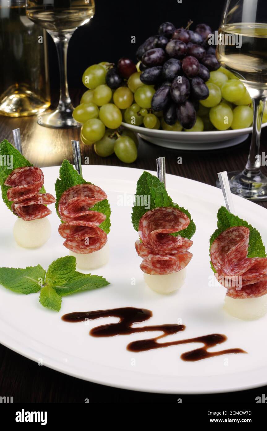 Canape of balls with a melon and salami Stock Photo