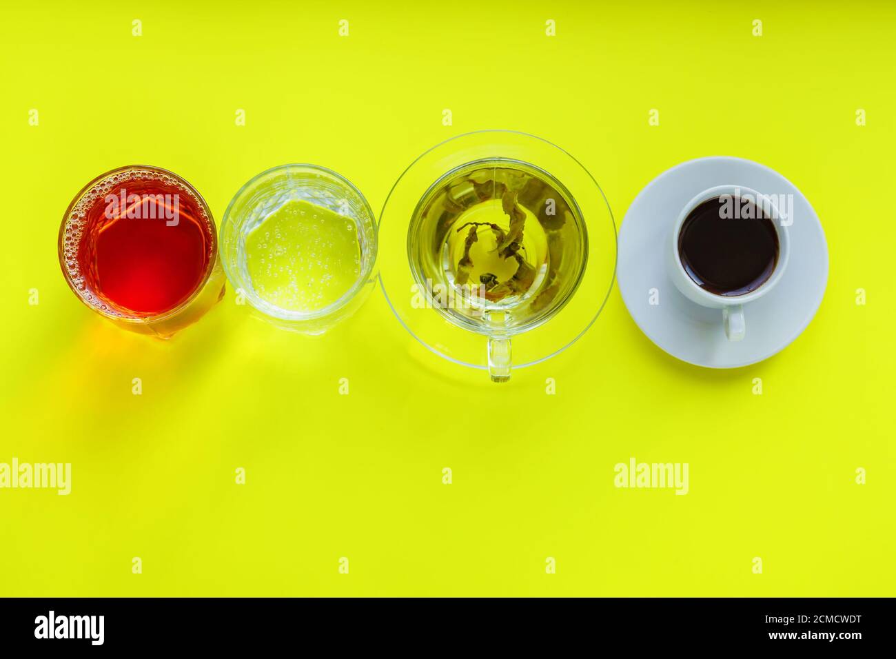 Top view of different beverages drinking coffe, sparkling water