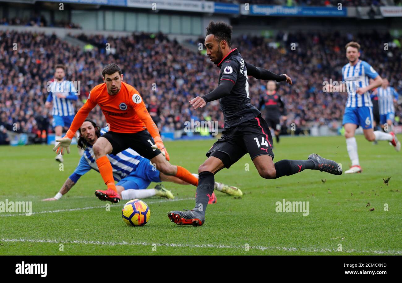 Soccer Football - Premier League - Brighton & Hove Albion vs Arsenal - The American Express Community Stadium, Brighton, Britain - March 4, 2018   Arsenal's Pierre-Emerick Aubameyang in action with Brighton's Mathew Ryan    REUTERS/Eddie Keogh    EDITORIAL USE ONLY. No use with unauthorized audio, video, data, fixture lists, club/league logos or 'live' services. Online in-match use limited to 75 images, no video emulation. No use in betting, games or single club/league/player publications.  Please contact your account representative for further details. Stock Photo