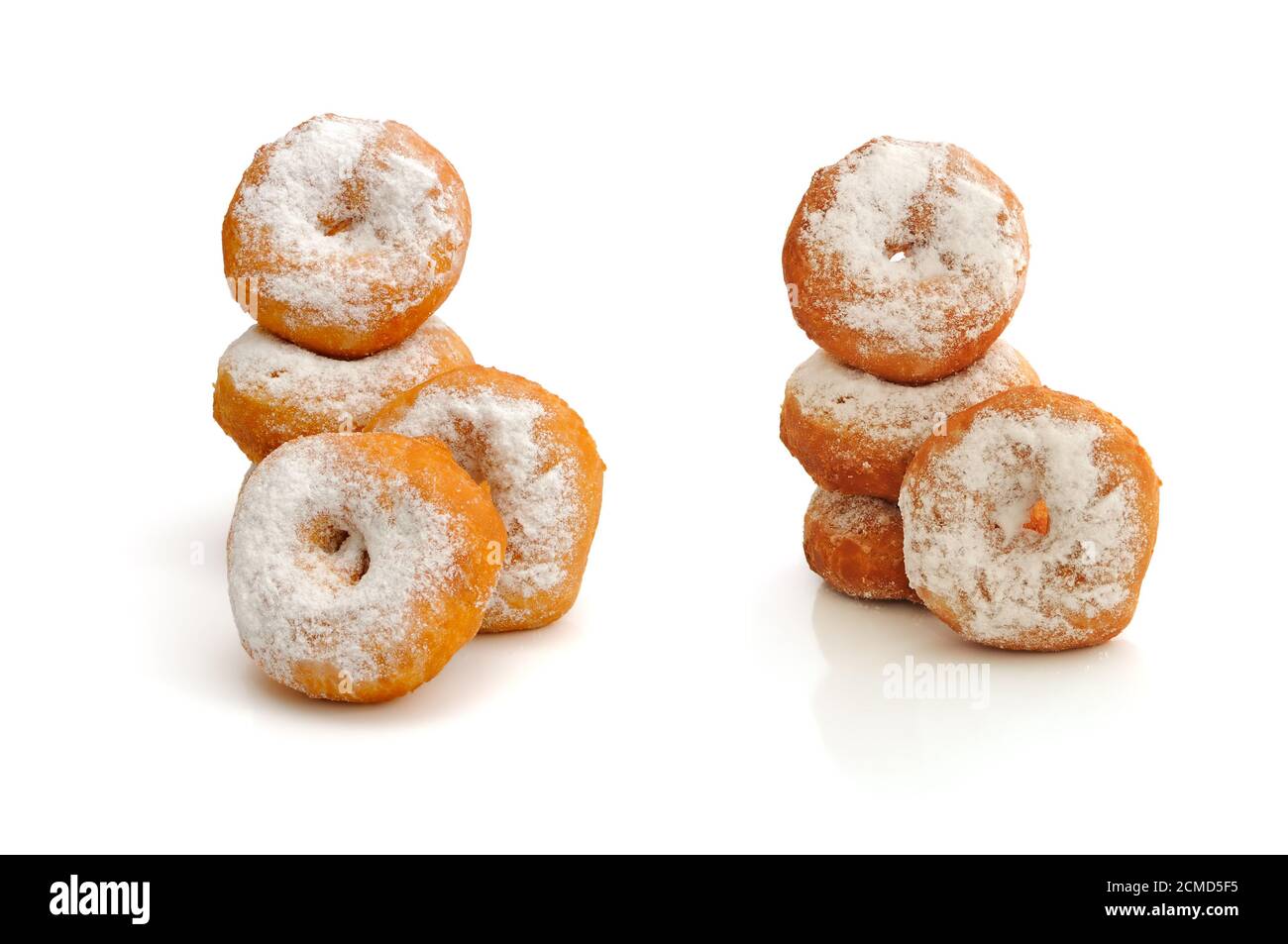 Fried donuts in powdered sugar on a white background Stock Photo Alamy