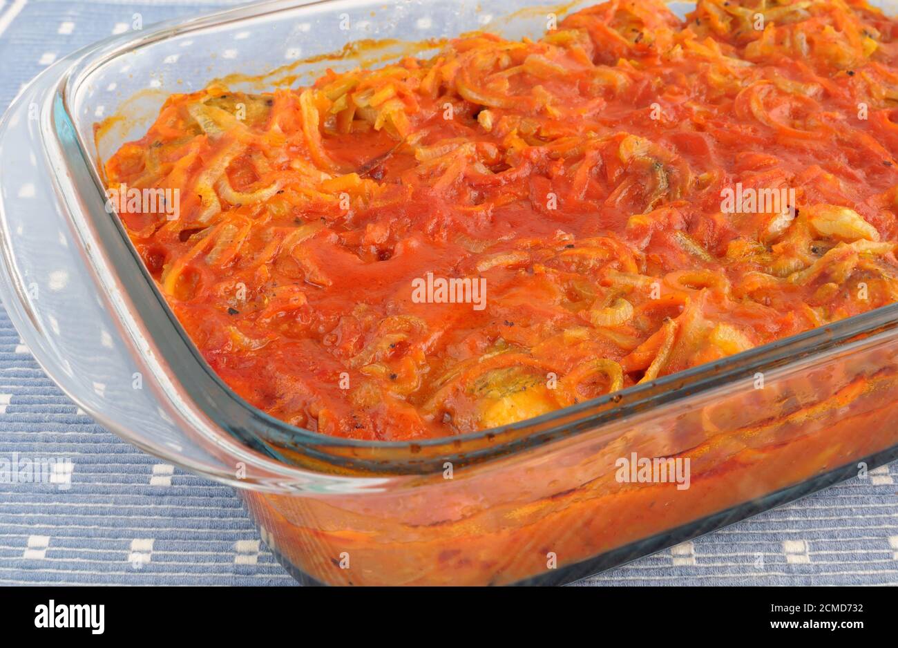 Baked fish in tomato sauce with vegetables Stock Photo Alamy