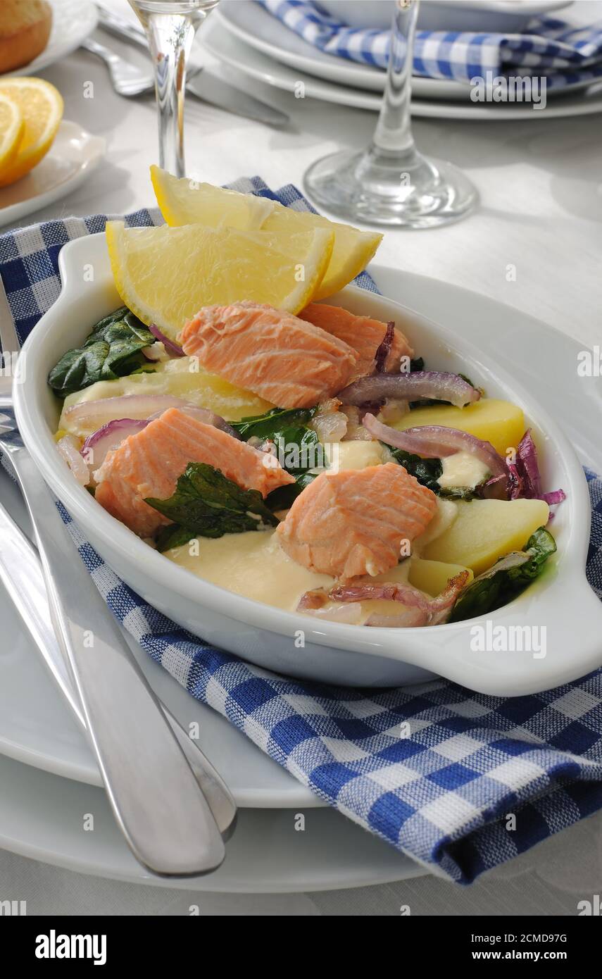 Salmon with potatoes and spinach cream sauce Stock Photo - Alamy